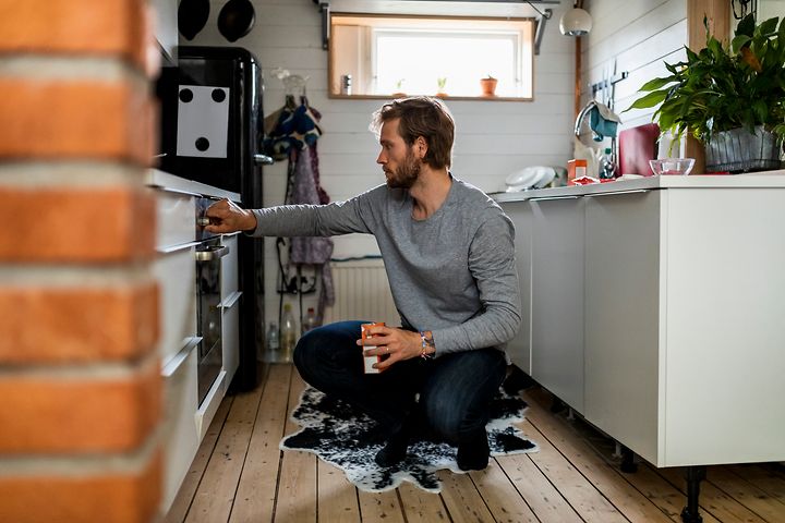 Man checking the oven